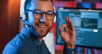 A person with glasses and a headset